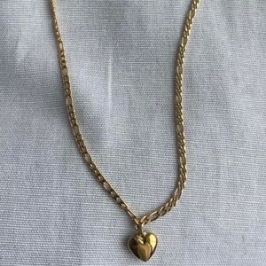 Super cute and dainty gold chain link necklace with gold heart charm.